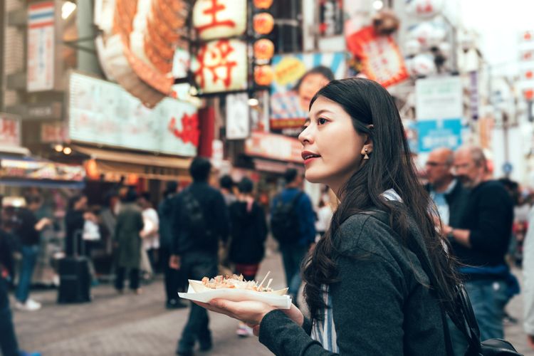 woman eating takoyaki