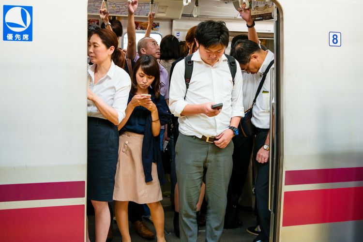 passengers by a train door