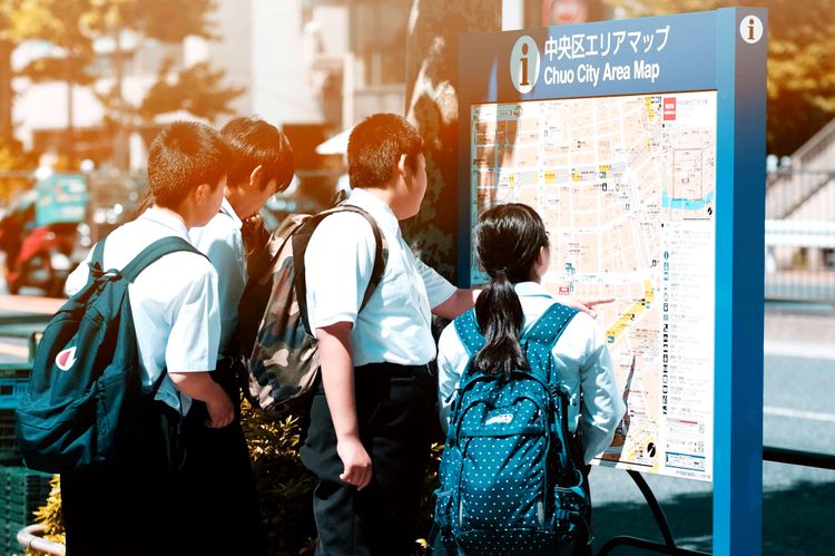 japanese students looking at map