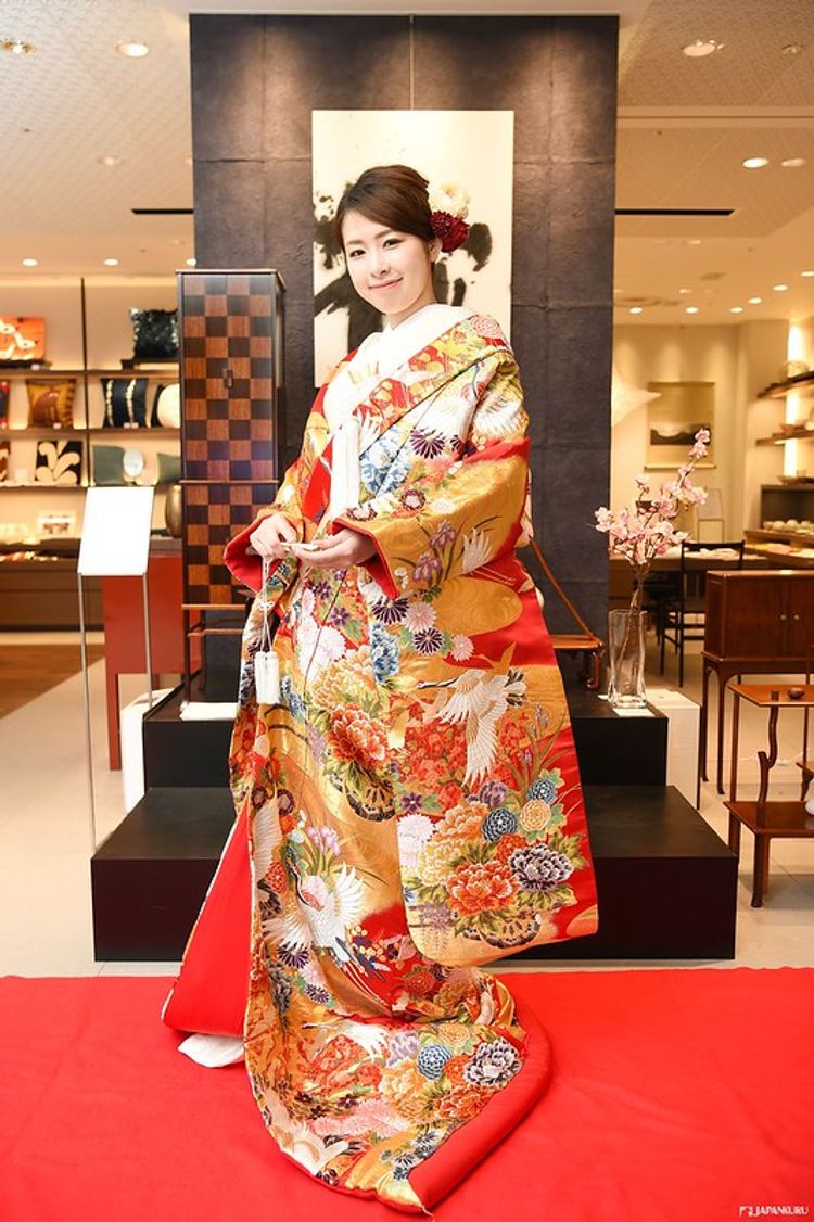 woman wearing a red and gold kimono