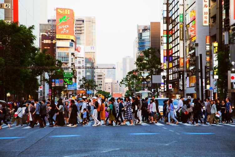 people crossing busy tokyo street