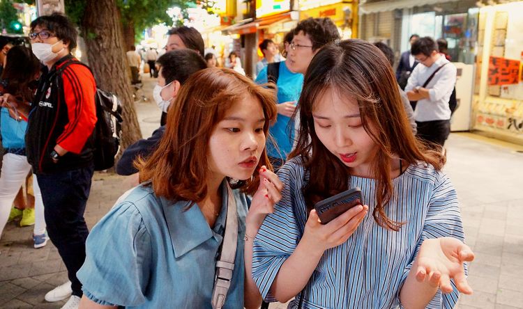 Two Japanese women on an outdoor street